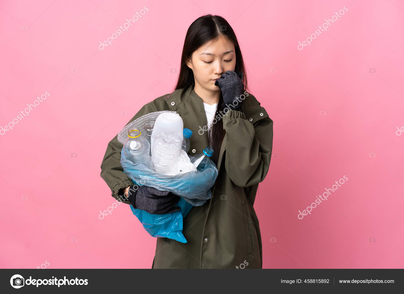 Chinese Girl Holding Bag Full Plastic Bottles Recycle Isolated Pink