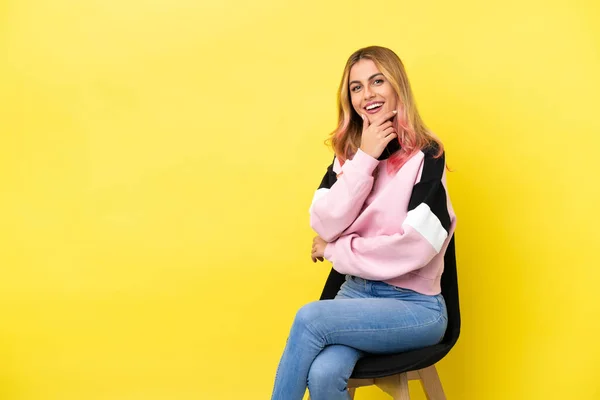 Young Woman Sitting Chair Isolated Yellow Background Happy Smiling — Stock Photo, Image