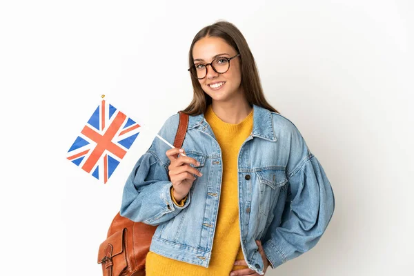 Jovem Hispânica Segurando Uma Bandeira Reino Unido Sobre Fundo Branco — Fotografia de Stock