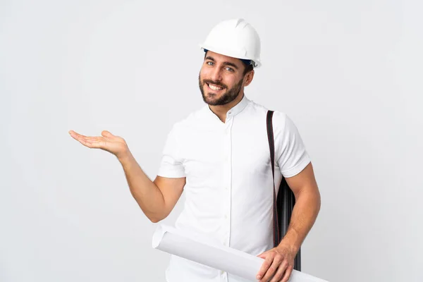 Jonge Architect Man Met Helm Het Houden Van Blauwdrukken Geïsoleerd — Stockfoto