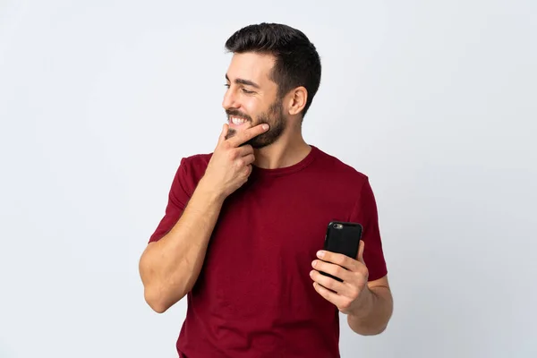 Junge Gutaussehende Mann Mit Bart Mit Handy Isoliert Auf Weißem — Stockfoto