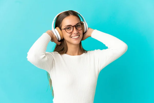 Young Woman Isolated Blue Background Listening Music — Stock Photo, Image