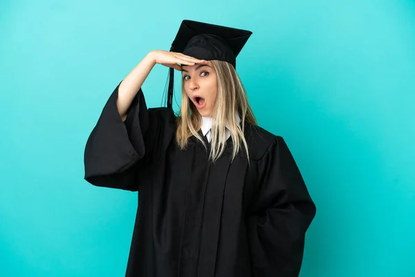 Young University Graduate Isolated Blue Background Doing Surprise Gesture While — Stock Photo, Image