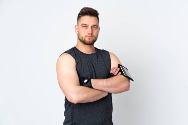 Rus sporcu beyaz arka planda izole edilmiş ve kolları bağlı.