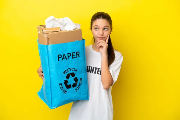 Little Girl Holding Recycling Bag Full Paper Recycle Isolated Yellow — Stock Photo, Image