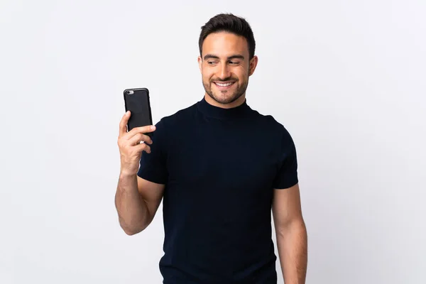 Jovem Caucasiano Usando Telefone Celular Isolado Fundo Branco Com Expressão — Fotografia de Stock
