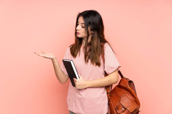 Young Student Woman Going University Isolated Pink Background Holding Copyspace — Stock Photo, Image