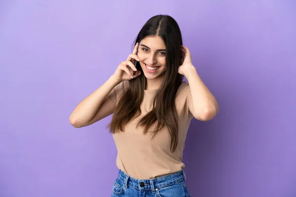 Young Caucasian Woman Using Mobile Phone Isolated Purple Background Laughing — Stock Photo, Image