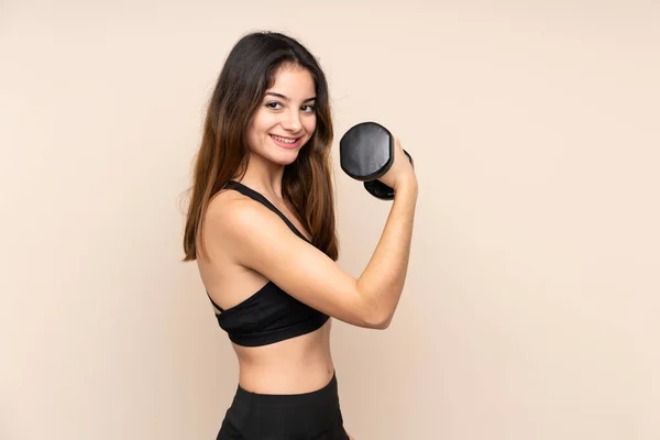 Mujer Deportiva Joven Haciendo Levantamiento Pesas Aislado Sobre Fondo Beige —  Fotos de Stock