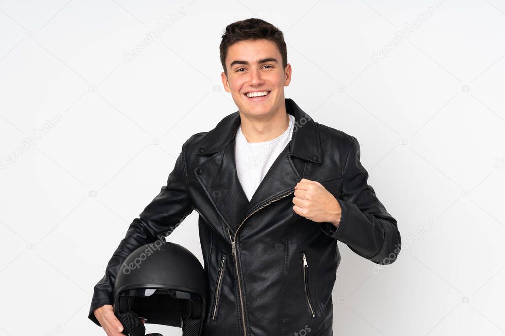Man holding a motorcycle helmet isolated on white background celebrating a victory