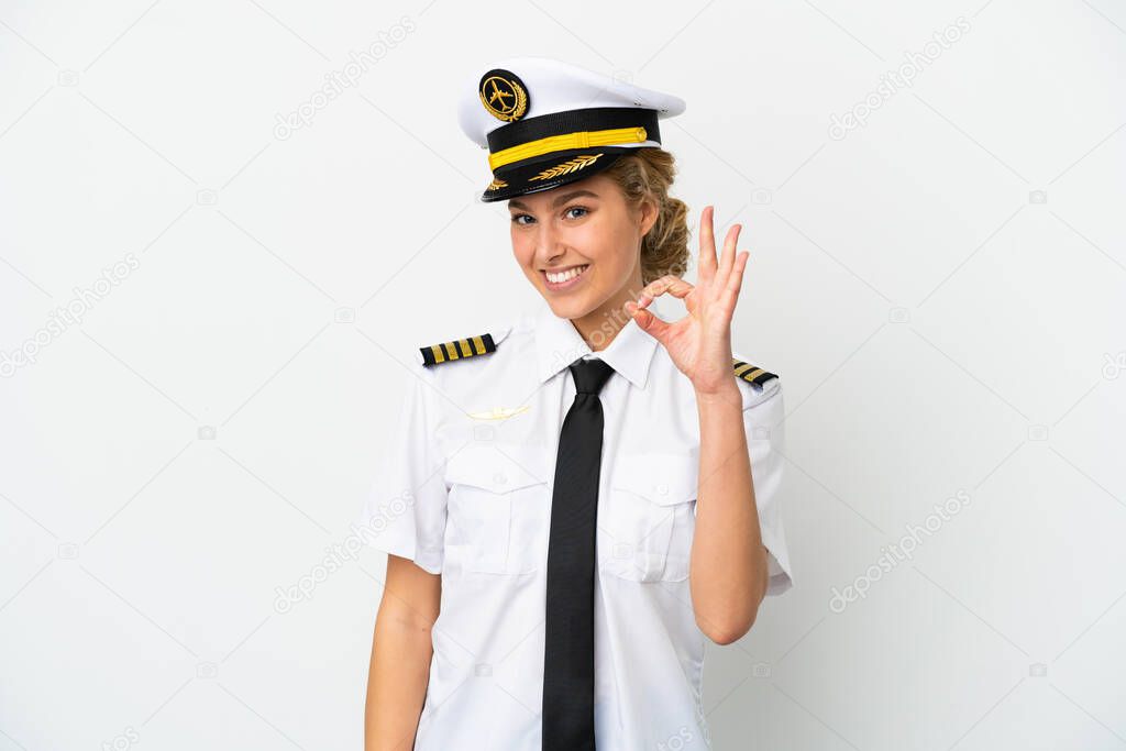 Airplane blonde woman pilot isolated on white background showing ok sign with fingers