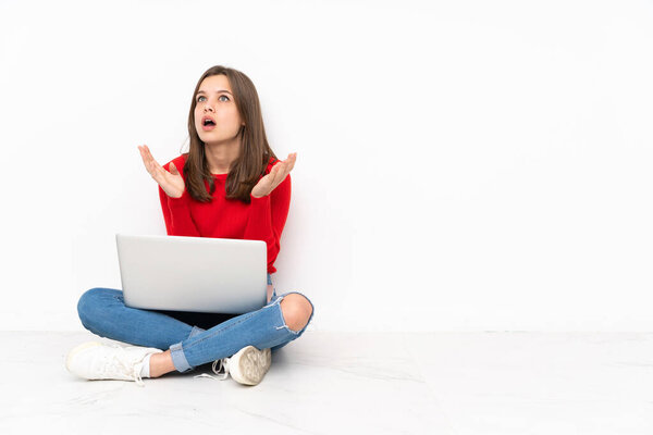 Tenaager girl working with pc isolated on white background frustrated by a bad situation