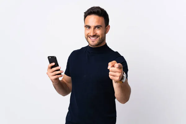 Молодий Білий Чоловік Використовує Мобільний Телефон Ізольований Білому Фоні Пальцем — стокове фото