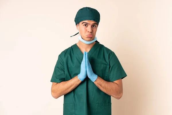 Surgeon Man Blue Uniform Isolated Background Pleading — Foto de Stock