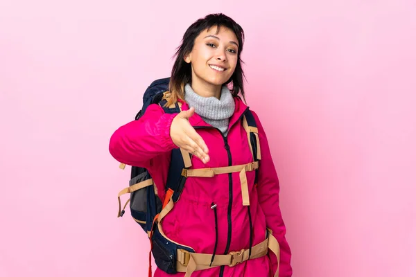 Young Mountaineer Girl Big Backpack Isolated Pink Background Handshaking Good — 스톡 사진