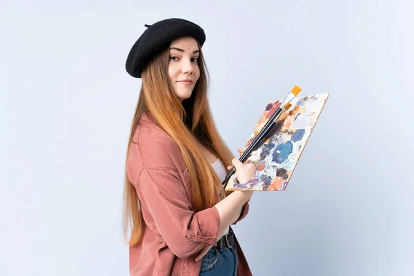 Jovem Artista Mulher Segurando Uma Paleta Isolada Fundo Azul Rindo — Fotografia de Stock