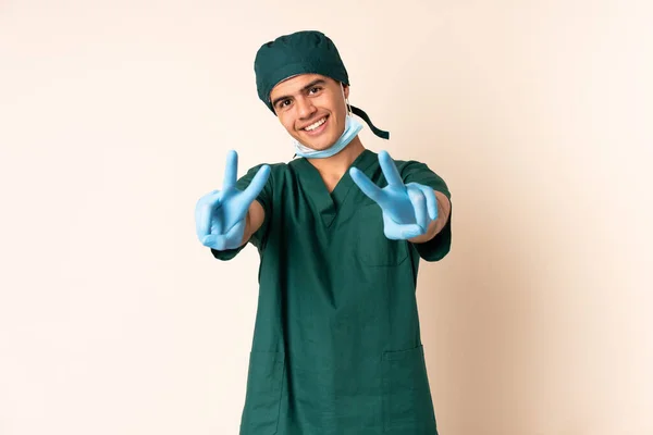 Surgeon Man Blue Uniform Isolated Background Smiling Showing Victory Sign — Stock Photo, Image