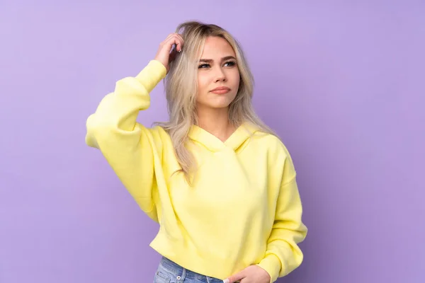 Teenager Girl Wearing Yellow Sweatshirt Isolated Purple Background Having Doubts — Fotografia de Stock