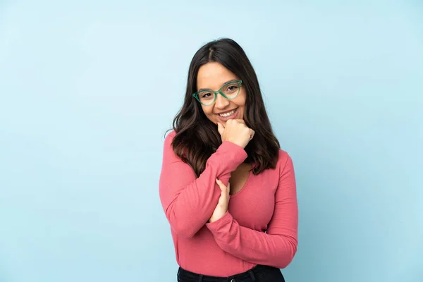 Young Mixed Race Woman Isolated Blue Background Glasses Smiling — Stock Photo, Image