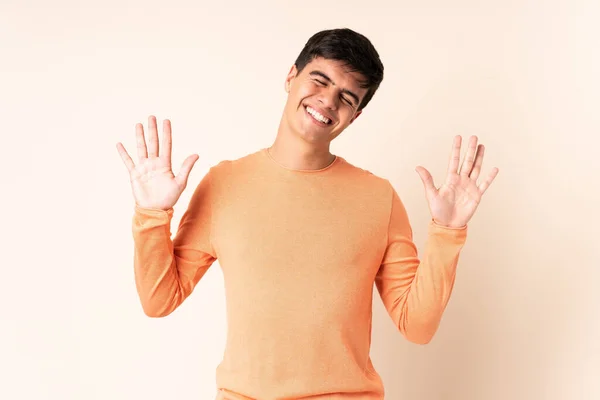 Handsome Man Isolated Beige Background Counting Ten Fingers — Stok fotoğraf