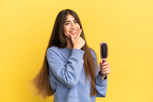 Young Caucasian Woman Holding Hairbrush Isolated Blue Background Happy Smiling — Zdjęcie stockowe