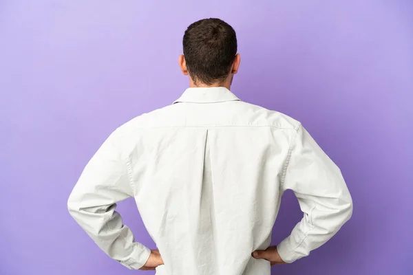 Brazilian Man Isolated Purple Background Back Position — Stock Photo, Image