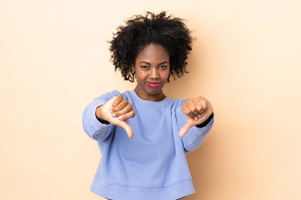 Young African American Woman Isolated Beige Background Showing Thumb Two — Stock Photo, Image