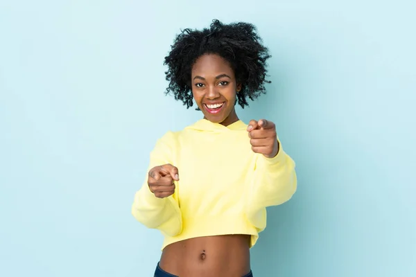 Young African American Woman Isolated Blue Background Surprised Pointing Front — Stock Photo, Image