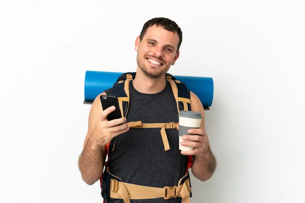 Brazilian Mountaineer Man Big Backpack Isolated White Background Holding Coffee — Stock Photo, Image