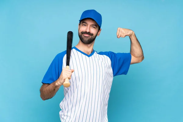 Young Man Playing Baseball Isolated Blue Background Doing Strong Gesture — Stock Photo, Image