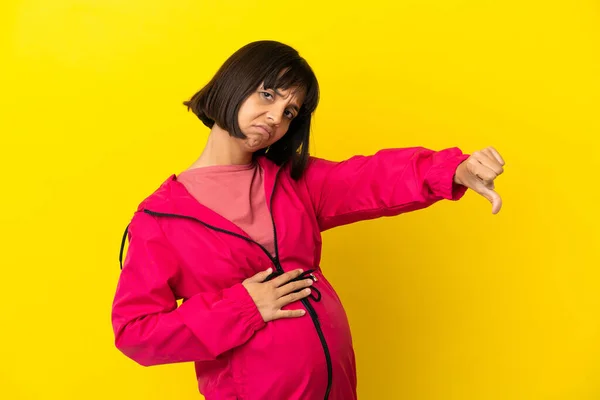 Young Pregnant Woman Isolated Yellow Background Showing Thumb Negative Expression — Stock Photo, Image