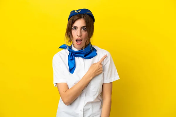 Airplane Stewardess Woman Isolated Yellow Background Surprised Pointing Side — Stock Photo, Image