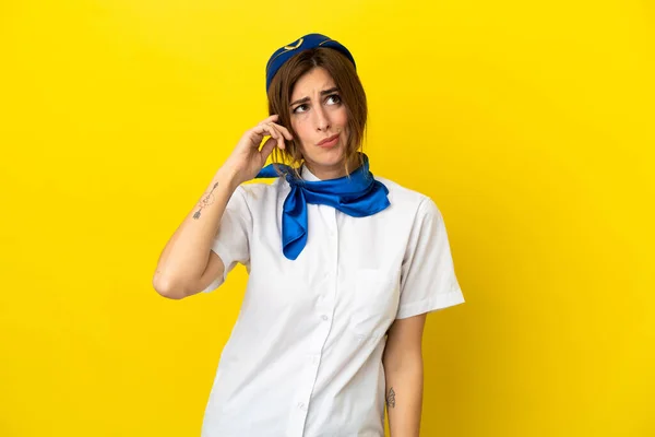 Airplane Stewardess Woman Isolated Yellow Background Having Doubts Confuse Face — Stock Photo, Image