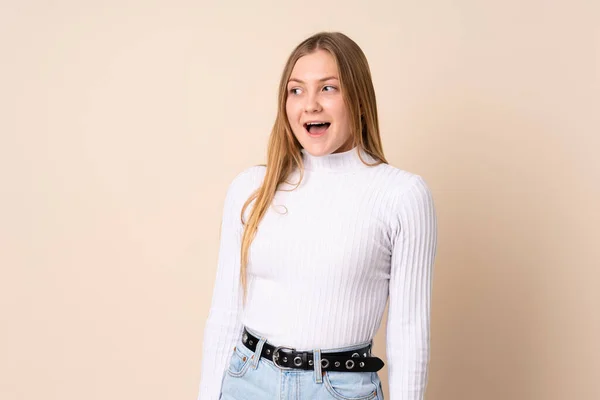 Teenager Ukrainian Girl Isolated Beige Background Doing Surprise Gesture While — Stock Photo, Image