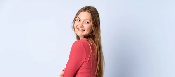 Teenager Ukrainian Girl Isolated Blue Background Looking Side Smiling — Stock Photo, Image