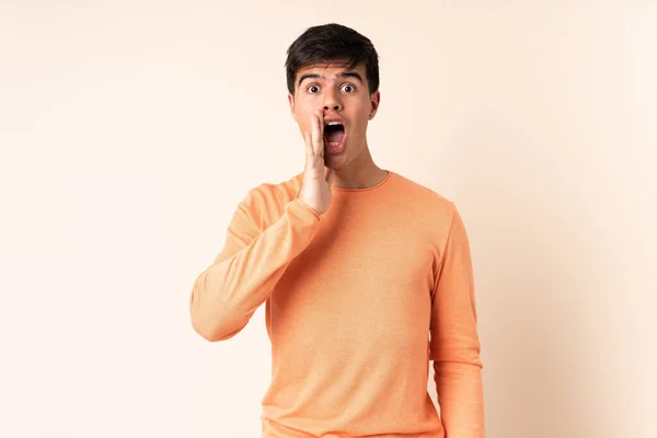 Handsome Man Isolated Beige Background Surprise Shocked Facial Expression — Stock Photo, Image