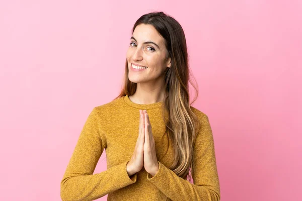 Young Caucasian Woman Isolated Pink Background Keeps Palm Together Person — Stock Photo, Image