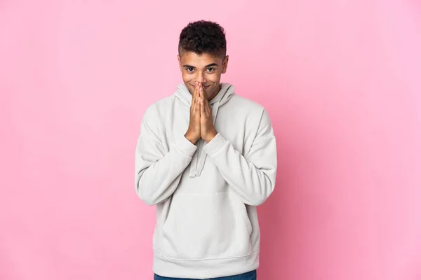 Young Brazilian Man Isolated Pink Background Keeps Palm Together Person — Stock Photo, Image