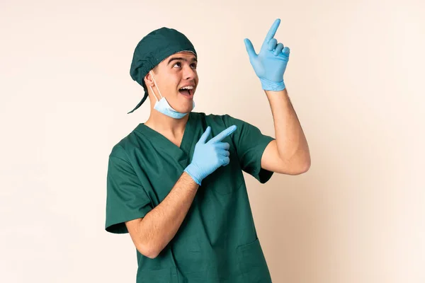 Cirujano Uniforme Azul Sobre Fondo Aislado Señalando Con Dedo Índice — Foto de Stock