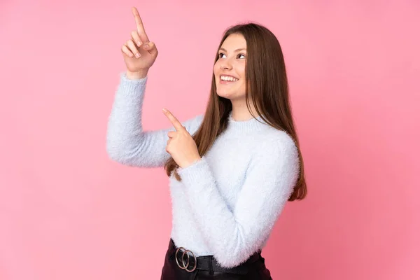 Teenager Caucasian Girl Isolated Pink Background Pointing Index Finger Great — ストック写真
