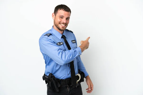 Young Police Brazilian Man Isolated White Background Pointing Back — ストック写真