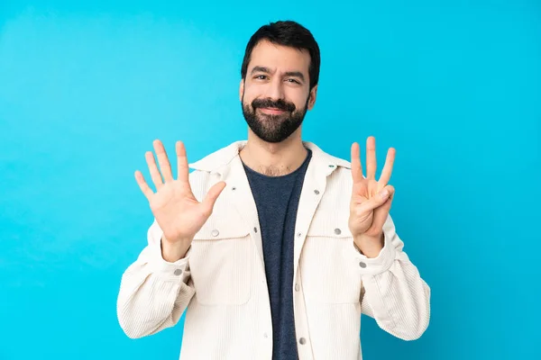 Junger Gutaussehender Mann Mit Weißer Cordjacke Über Isoliertem Blauem Hintergrund — Stockfoto