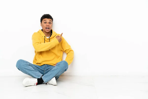 Young African American Man Sitting Floor Isolated White Background Surprised — Stock Photo, Image