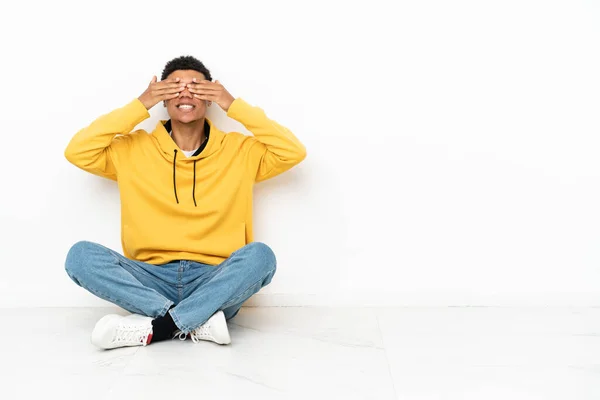 Young African American Man Sitting Floor Isolated White Background Covering — Stock Photo, Image