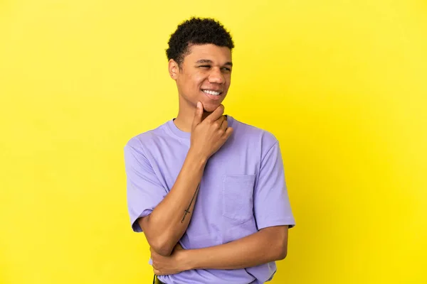 Young African American Man Isolated Yellow Background Looking Side Smiling — Stock Photo, Image