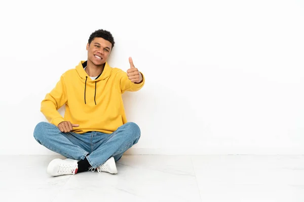 Young African American Man Sitting Floor Isolated White Background Thumbs — Stock Photo, Image