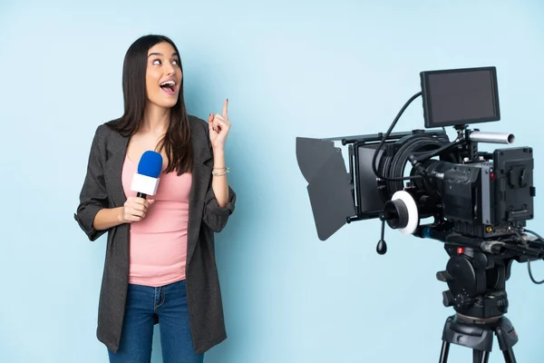 Reporter Woman Holding Microphone Reporting News Isolated Blue Background Intending — Stock Photo, Image