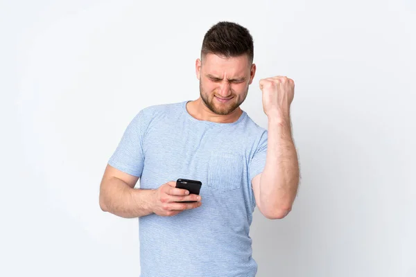 Hombre Guapo Ruso Sobre Fondo Aislado Con Teléfono Posición Victoria —  Fotos de Stock