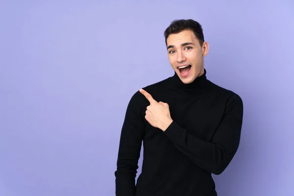 Young Caucasian Handsome Man Turtleneck Sweater Isolated Purple Background Surprised — Stock Photo, Image