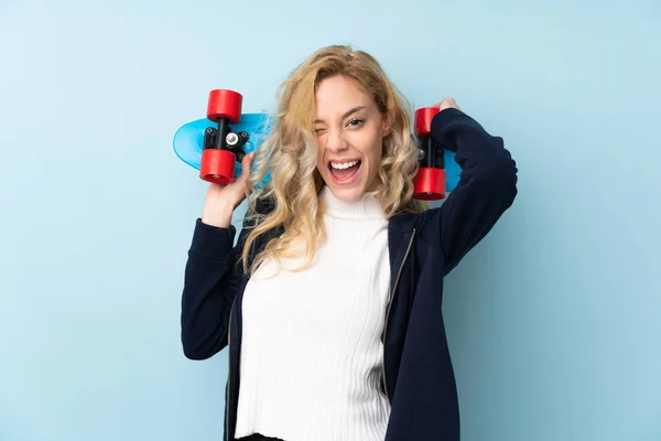 Young Blonde Woman Isolated Blue Background Skate — Stock Photo, Image